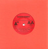 Wilco / Sleater-Kinney - Modern Girl / A Shot In The Arm (Tour Exclusive Translucent Orange 7" Vinyl)